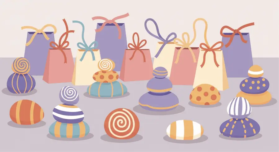 Decorated painted rocks arranged as prizes with colorful ribbons at community event