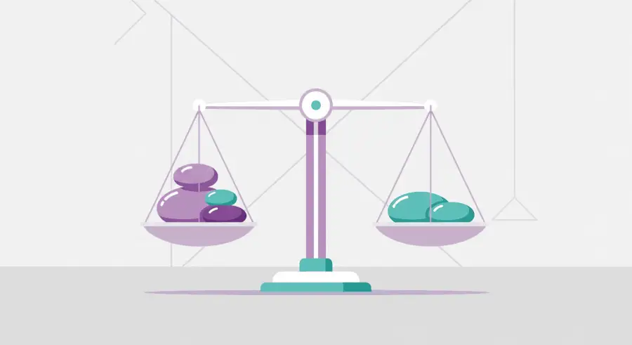 Balance scale weighing painted rocks for STEM measurement activity