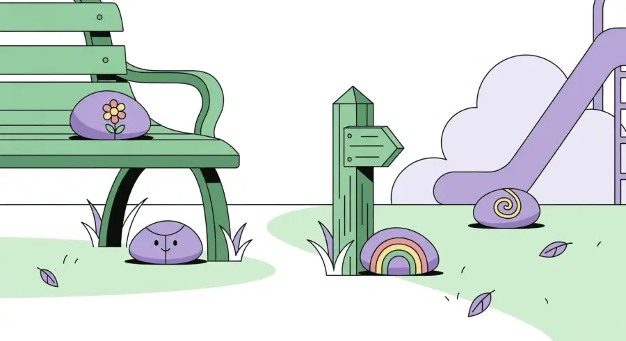 Painted rocks placed in ideal hiding spots on park bench, trail marker, and playground entrance